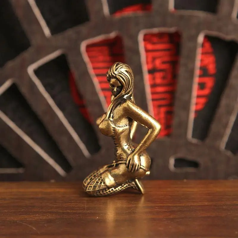 Side view of the kneeling woman miniature decorative figurine