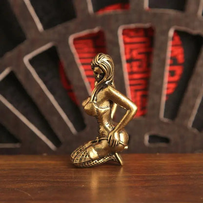 Side view of the kneeling woman miniature decorative figurine