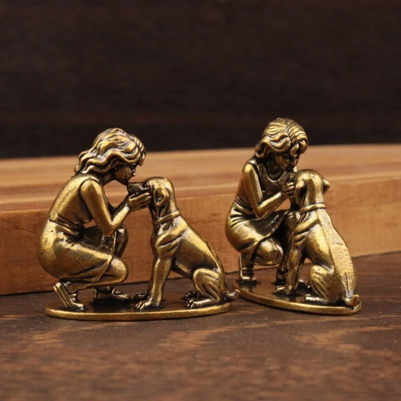Two miniature lady and dog figurines shown from front and side angles