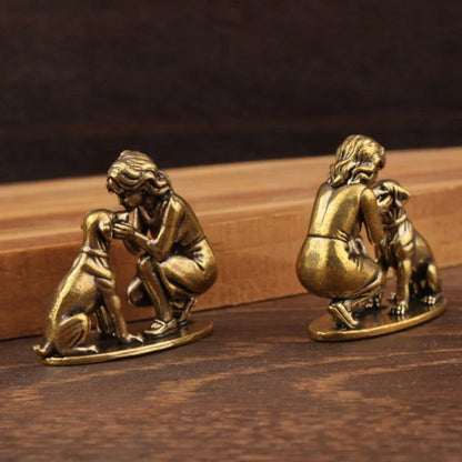 Rear views of the antique brass-tone lady and dog miniature figurines